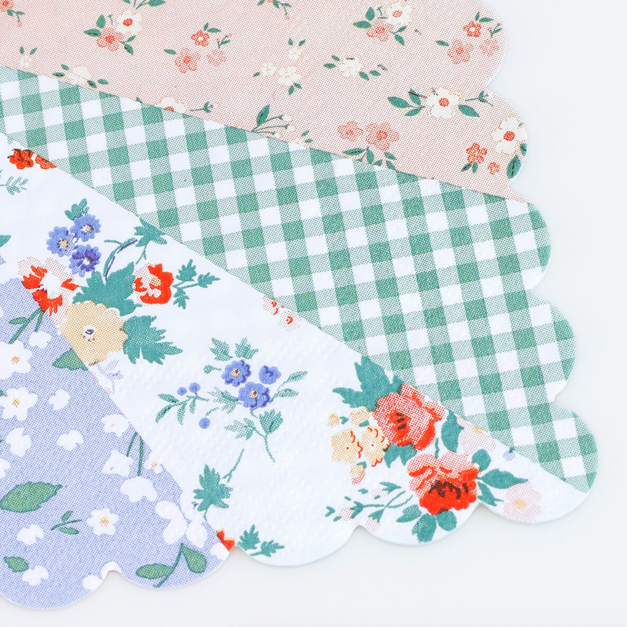 A napkin with floral and checkered patterns on a white background