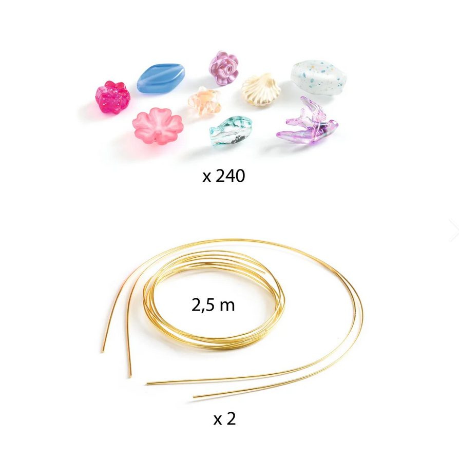 Assorted beads and gold wire on a white background