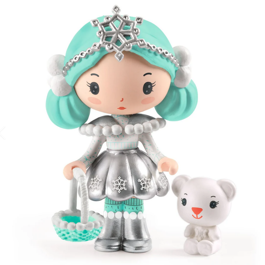 Toy figure with turquoise hair and silver outfit holding a small white dog on a white background