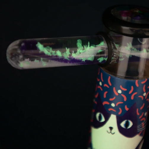 Glowing tube with a cat design on a dark background
