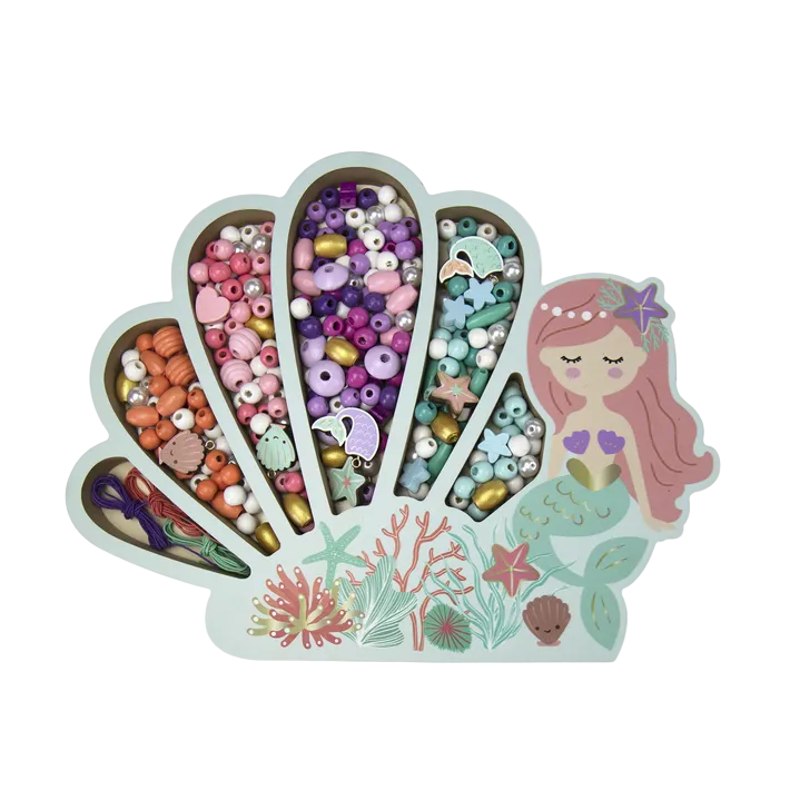 Mermaid-themed jewelry kit with beads and tools on a white background
