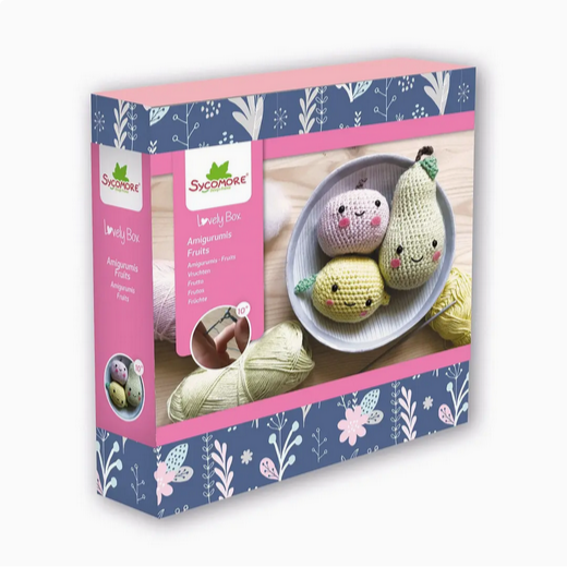 Crocheted fruit-shaped toys in a Sycamore kit packaging with floral design