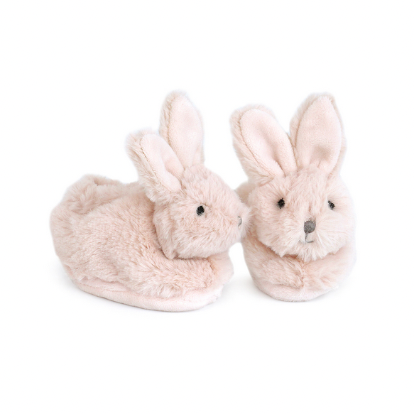 Pair of plush bunny slippers on a white background