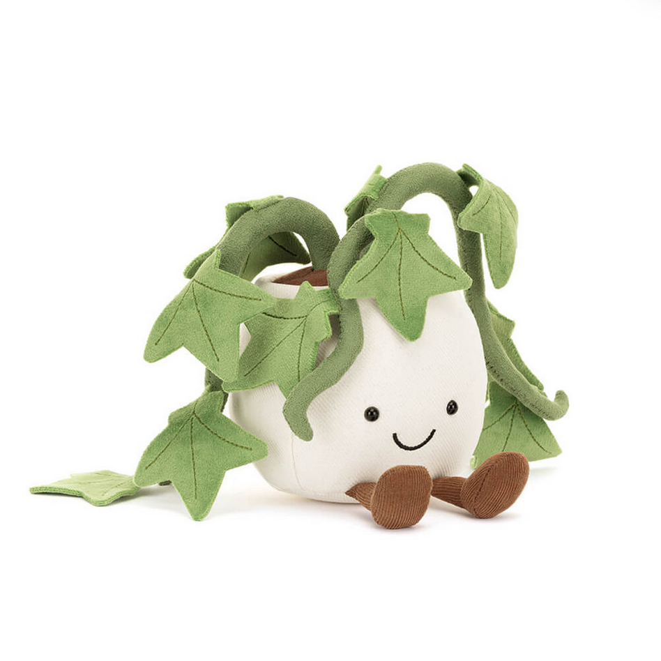 Plush toy shaped like a potted plant with a smiling face on a white background