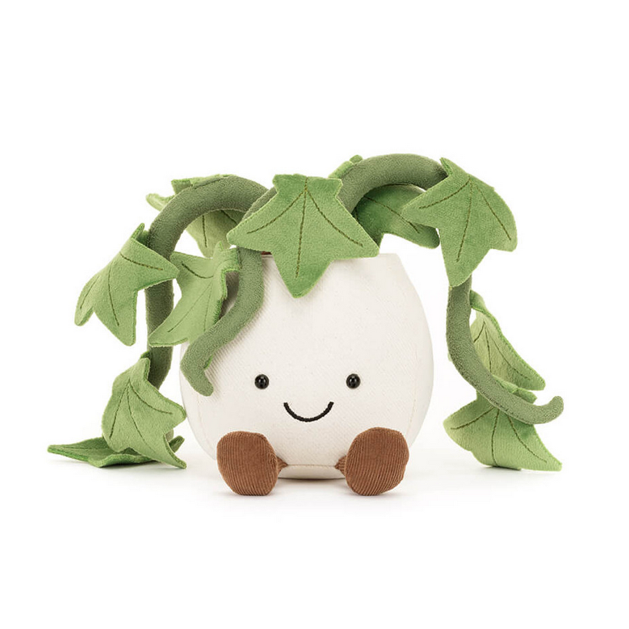 Plush toy shaped like a plant with green leaves on a white background