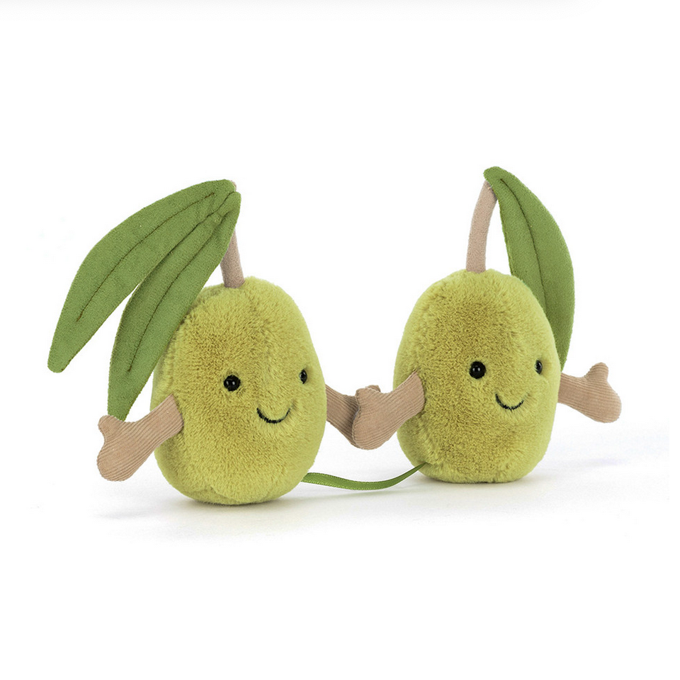 Two plush avocado toys with smiling faces on a white background