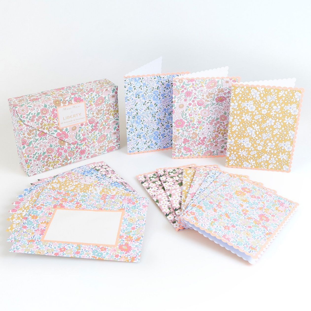 Set of small notebooks with floral patterns on a white background