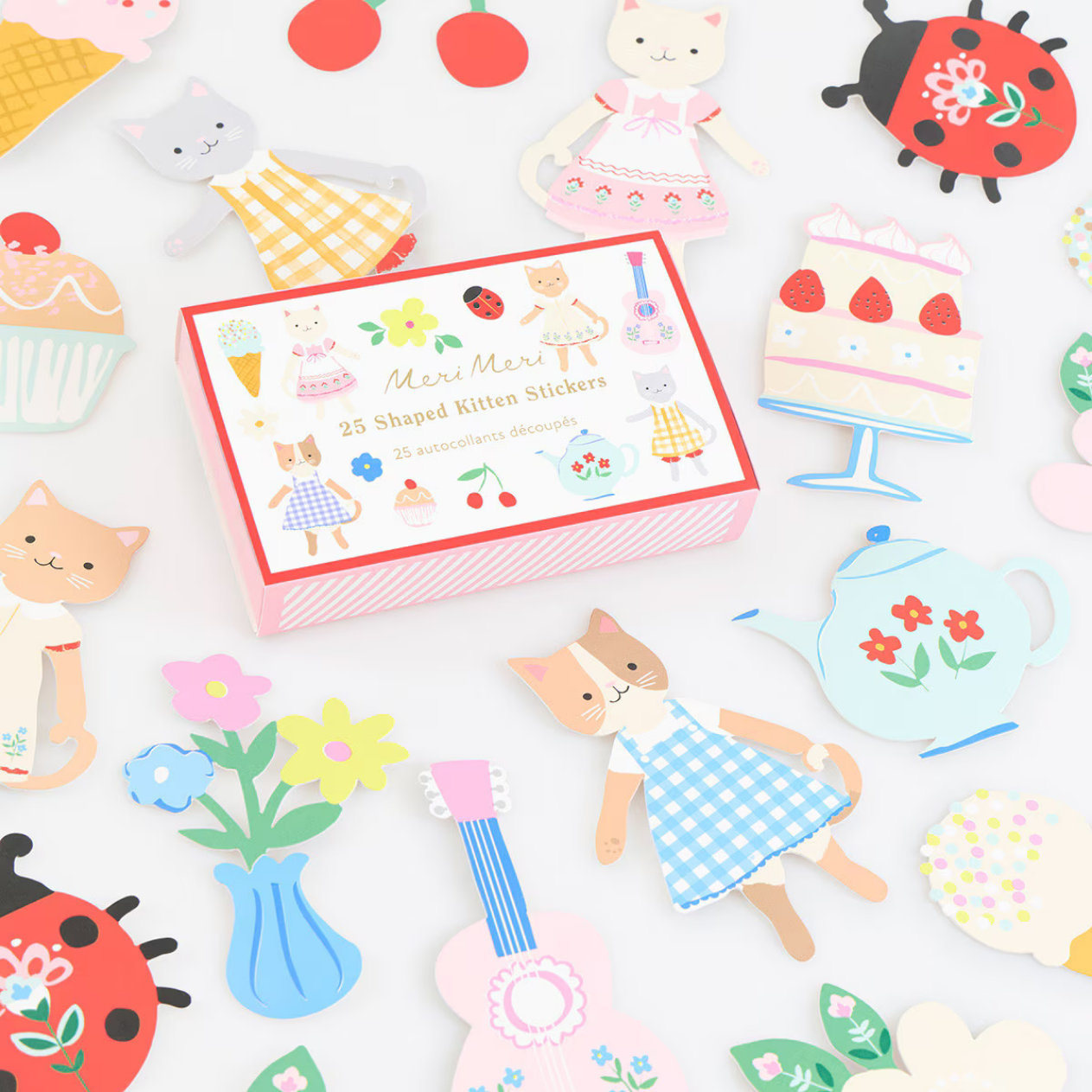 Collection of colorful stickers featuring cats, flowers, and other items on a white background.