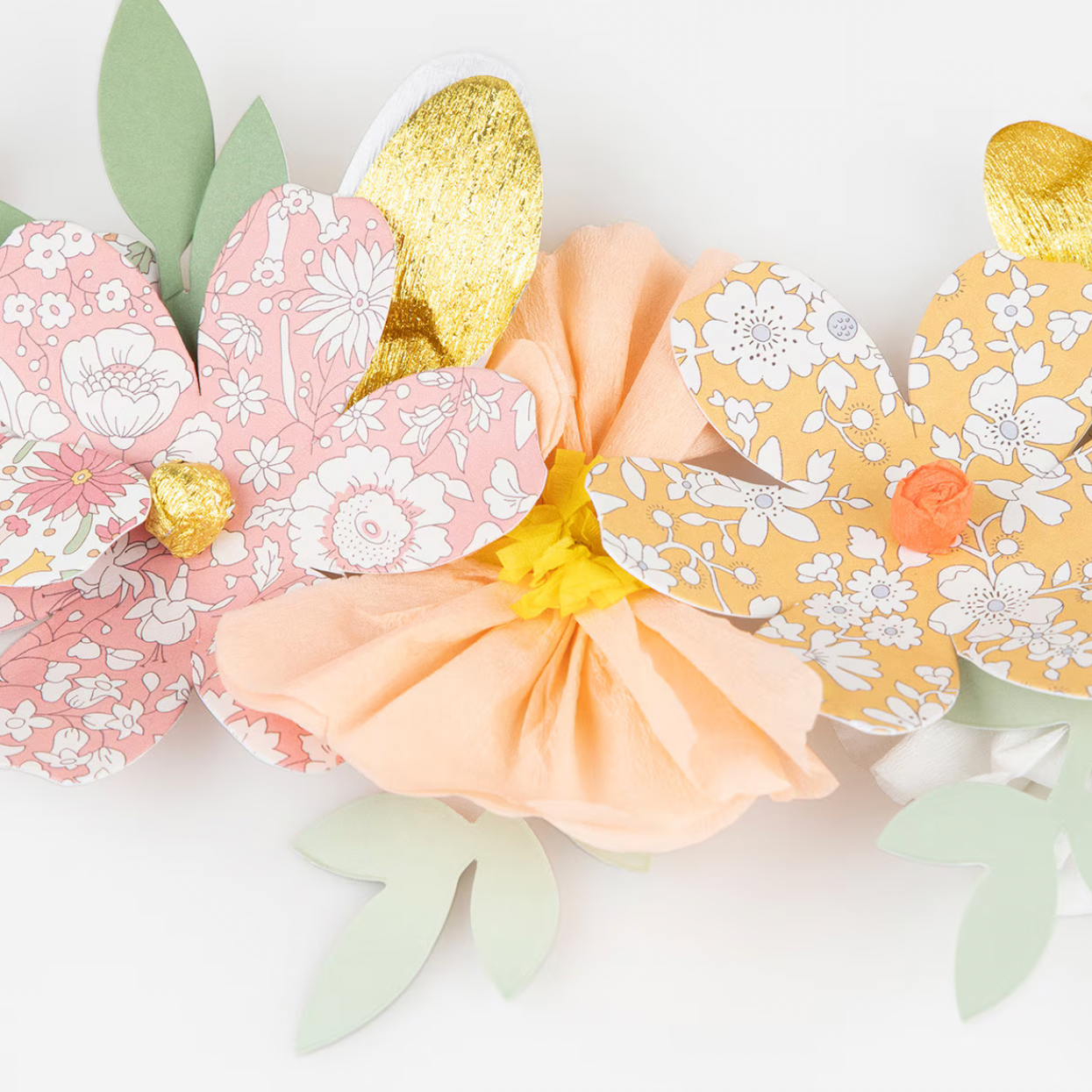 Decorative paper flowers with floral patterns on a white background