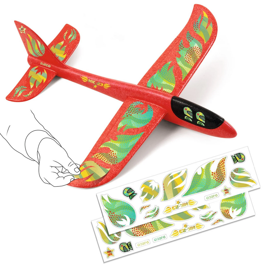Red toy airplane with green and yellow patterns on a white background