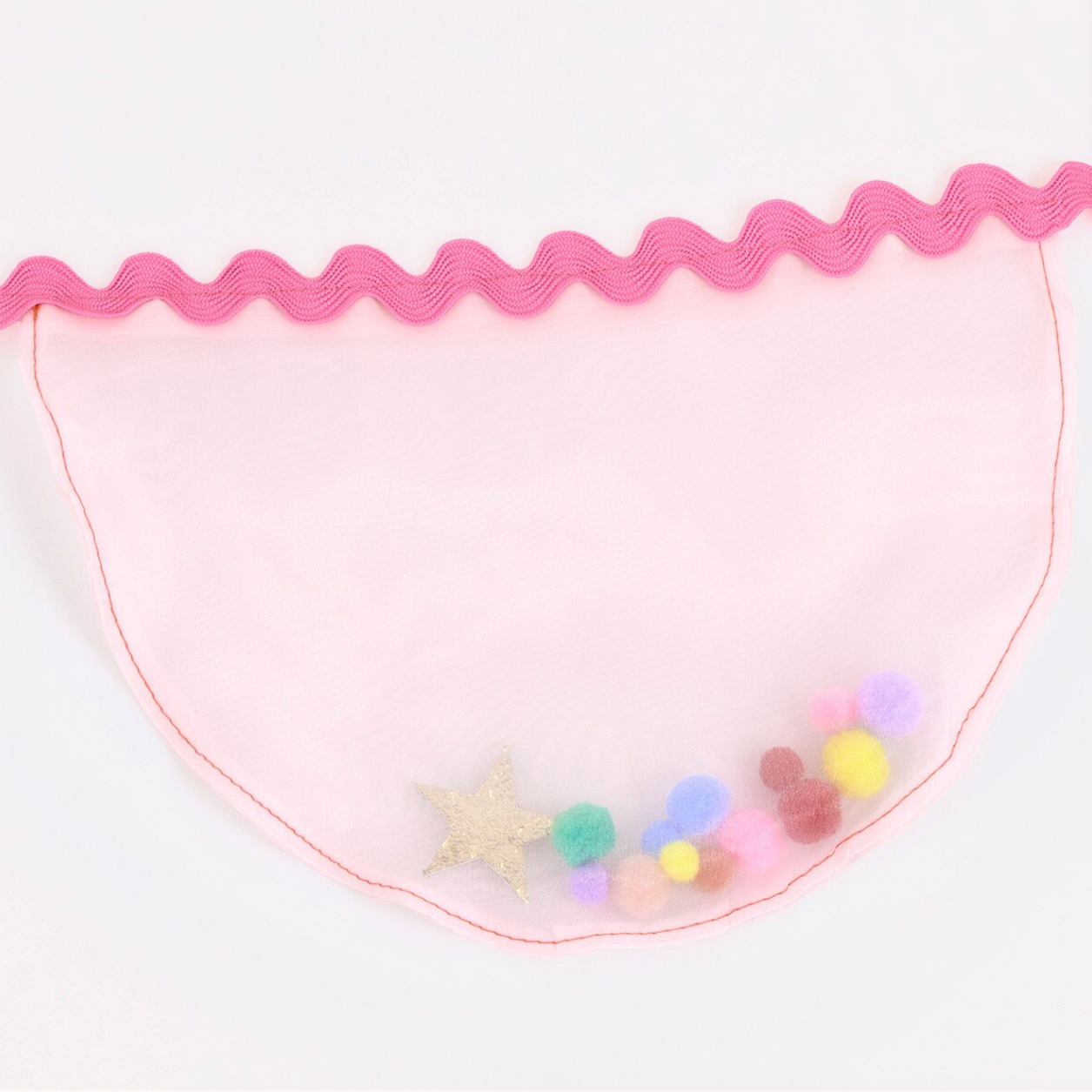 Pink scalloped edge with colorful pom-poms on a white background