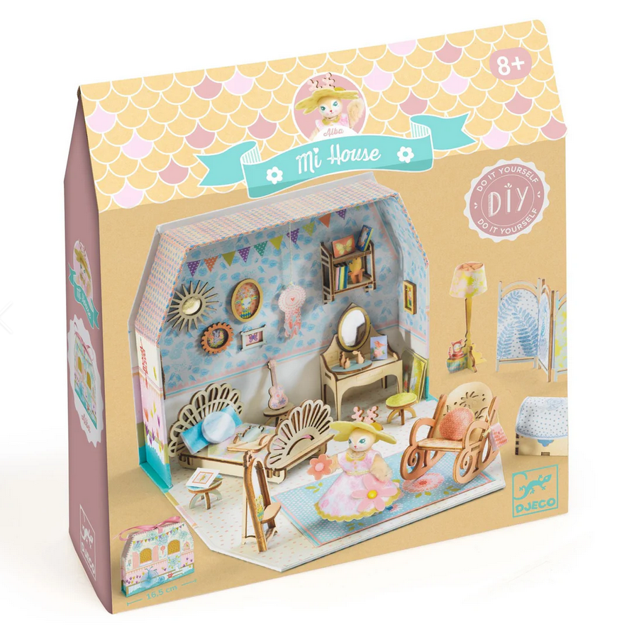 Diy dollhouse kit packaging with illustrations of a dollhouse and furniture on a white background