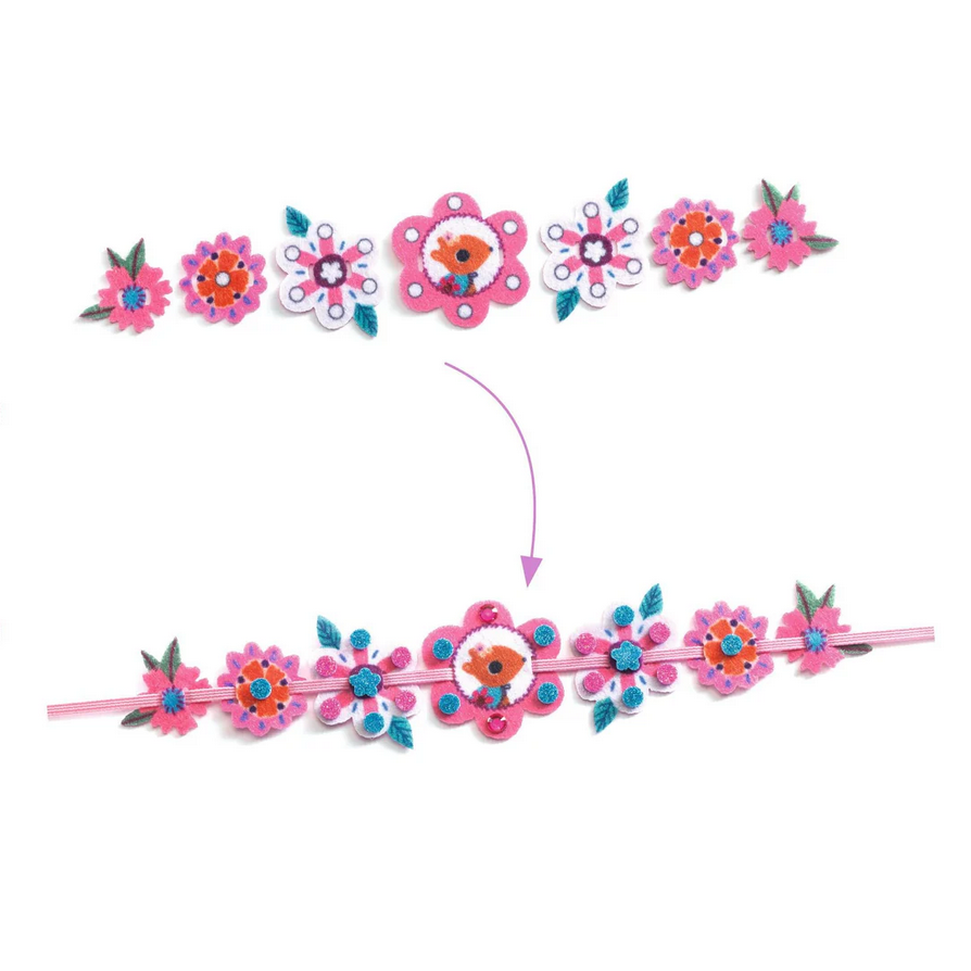 Floral headband with detachable flower pieces on a white background