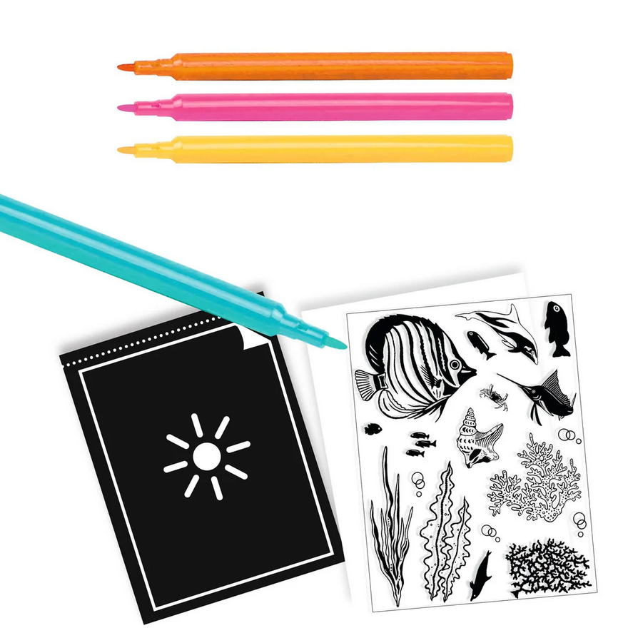 Coloring book with black and white illustrations and markers on a white background
