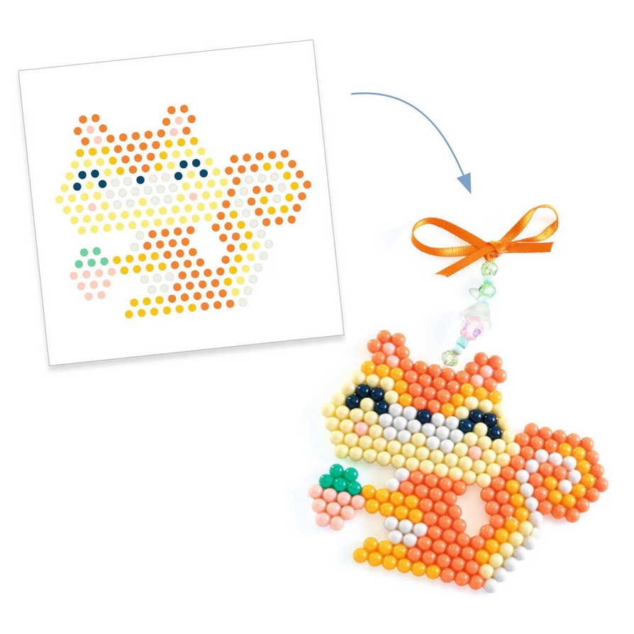 Beaded fox ornament with design template on a white background