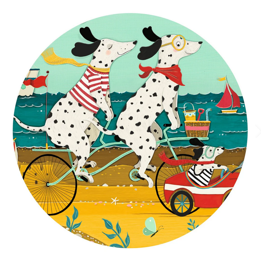 Illustration of two Dalmatians on a tandem bicycle with a third Dalmatian in a cart, set against a beach scene.
