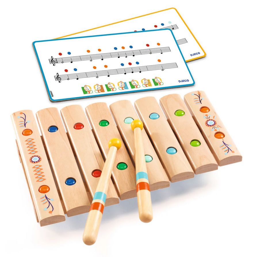 Wooden xylophone with colorful keys and two drumsticks on a white background