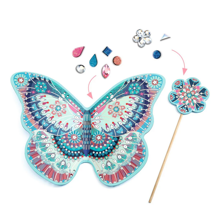 Decorative butterfly with gemstones and a wand on a white background