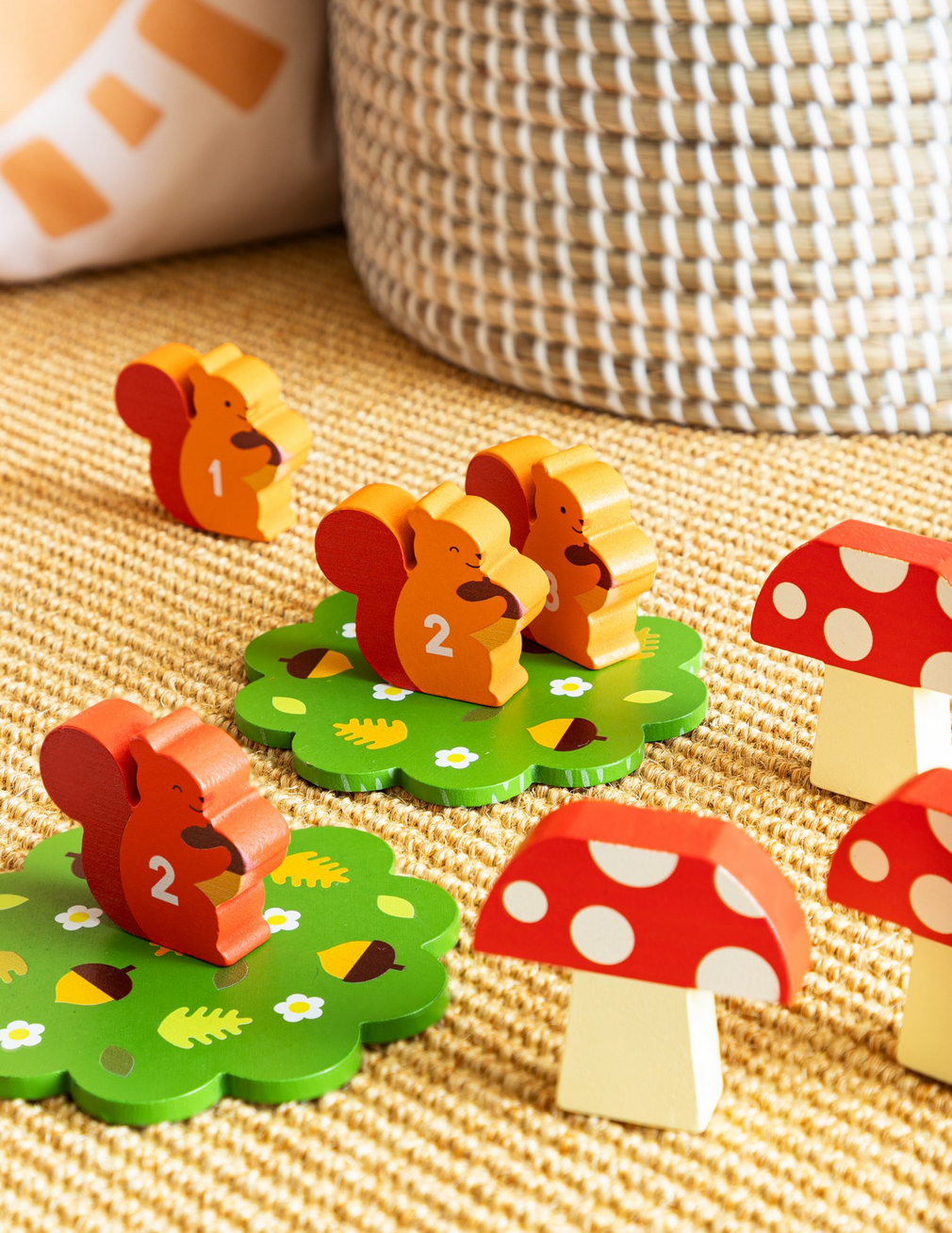Wooden toys with numbers and animal designs on a textured surface