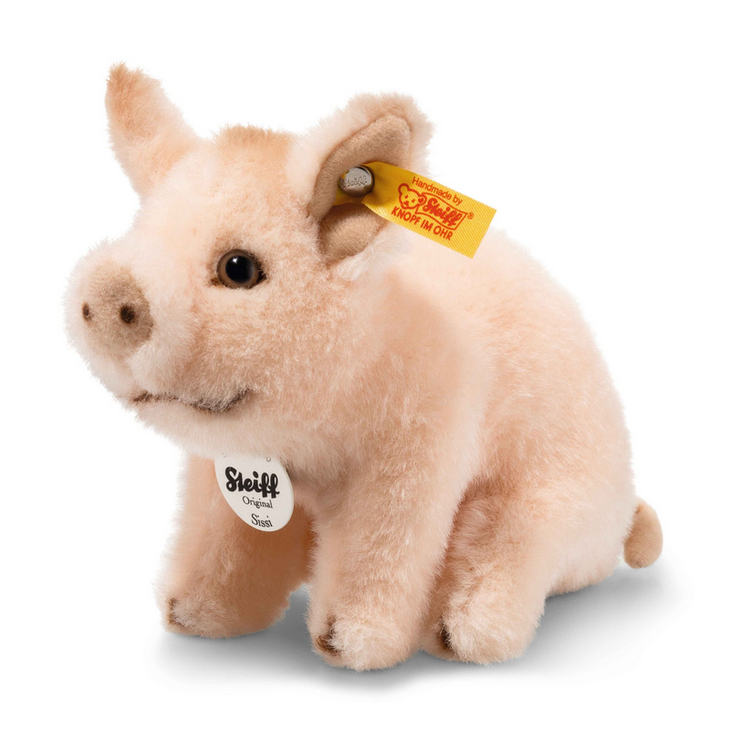 Plush pig toy with a visible brand tag on a white background