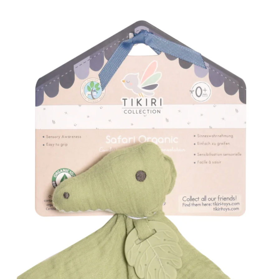 Green dinosaur toy with TIKIRI packaging on a white background