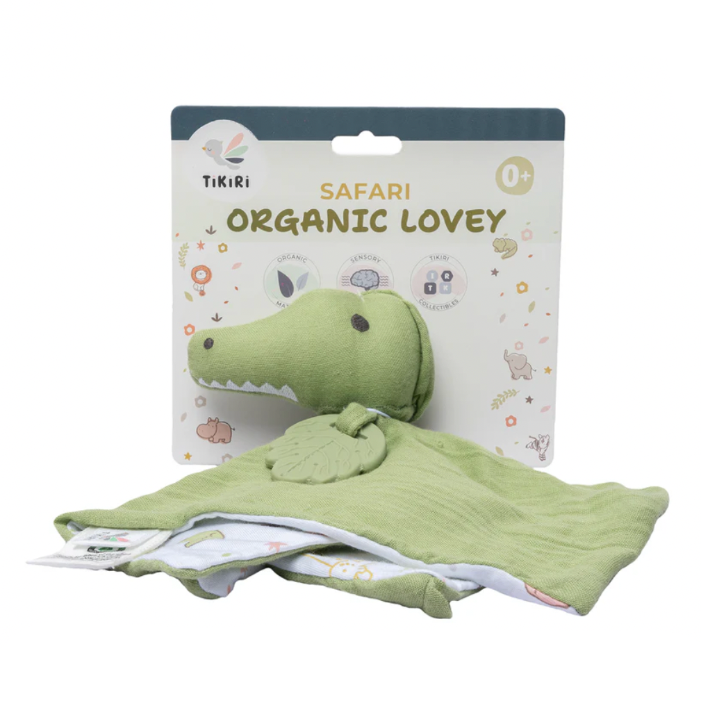 Green crocodile-shaped organic lovey with packaging on a white background