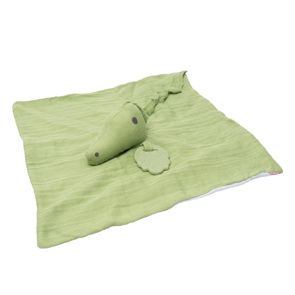 Green crocodile soft toy on a white background with Tikiri branding.