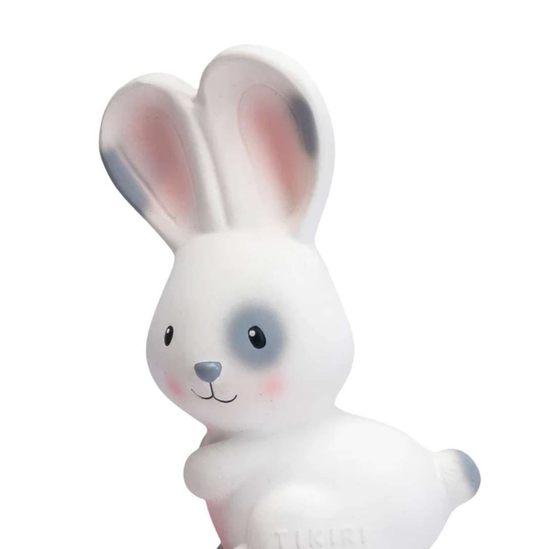 White rabbit toy with pink ears on a white background