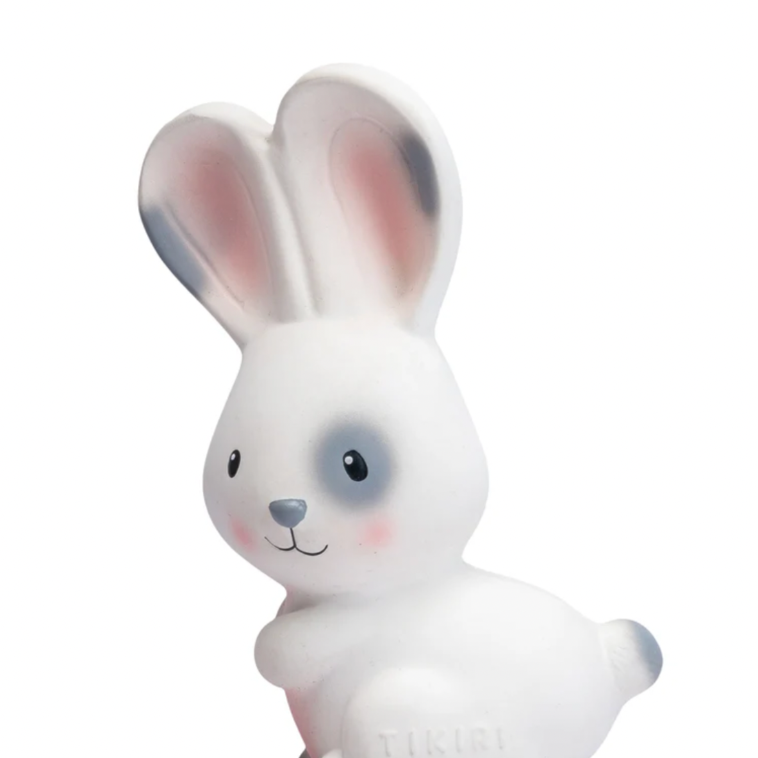 White rabbit toy with pink ears on a white background