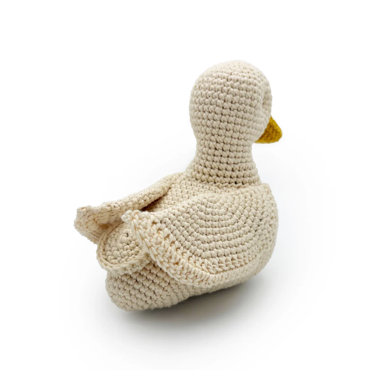 Crocheted duck toy on a white background