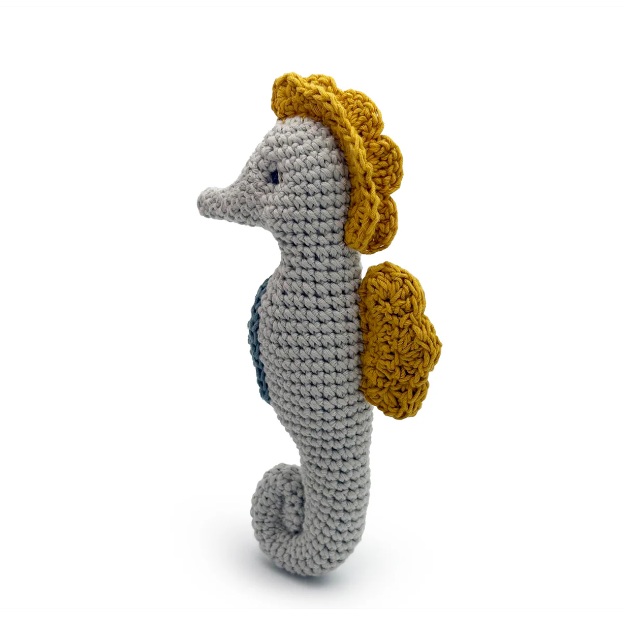 Crocheted seahorse toy with yellow shell on a white background