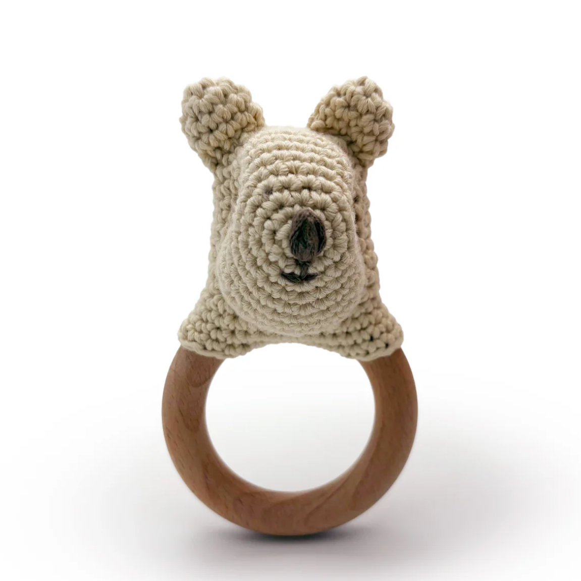 Knitted animal head on a wooden ring with a white background