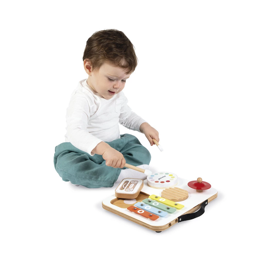 Child playing with a wooden toy on a white background