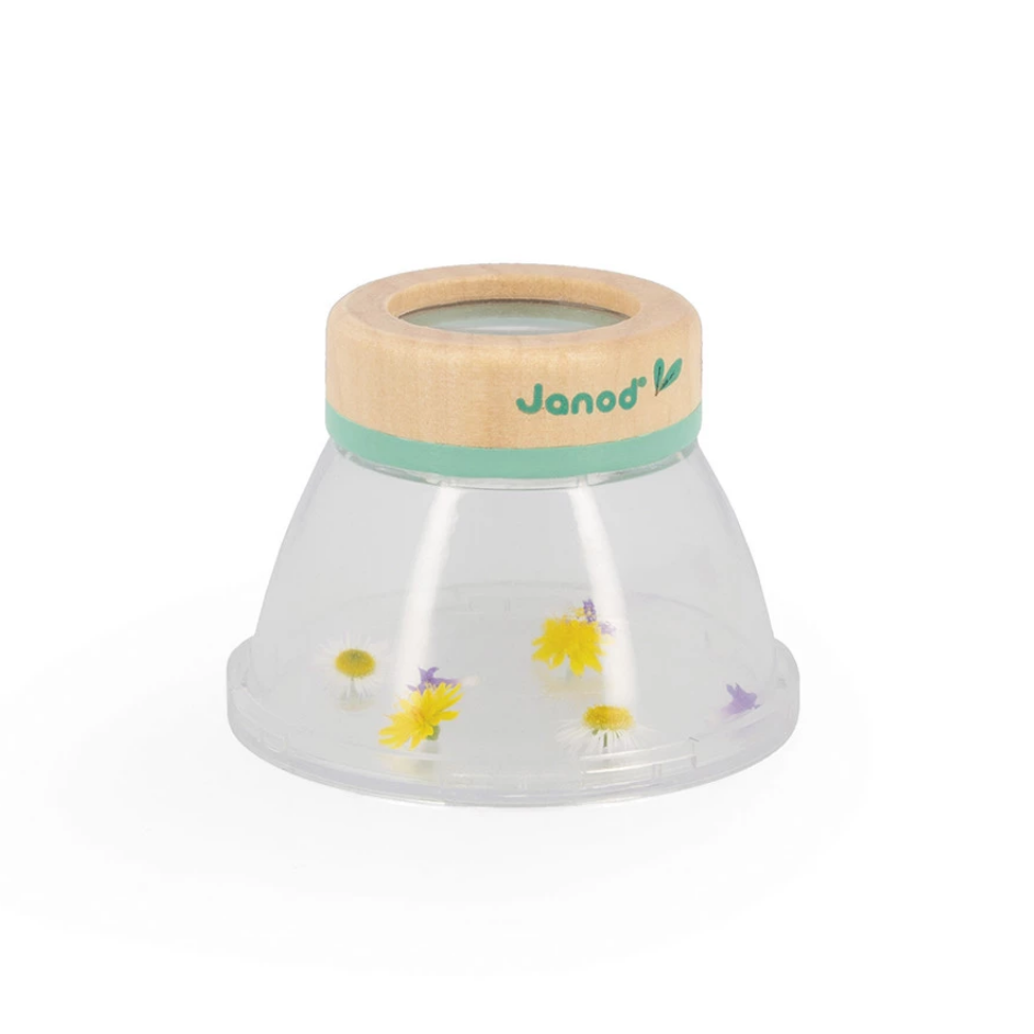 Children's toy with wooden top and clear body featuring floral designs on a white background
