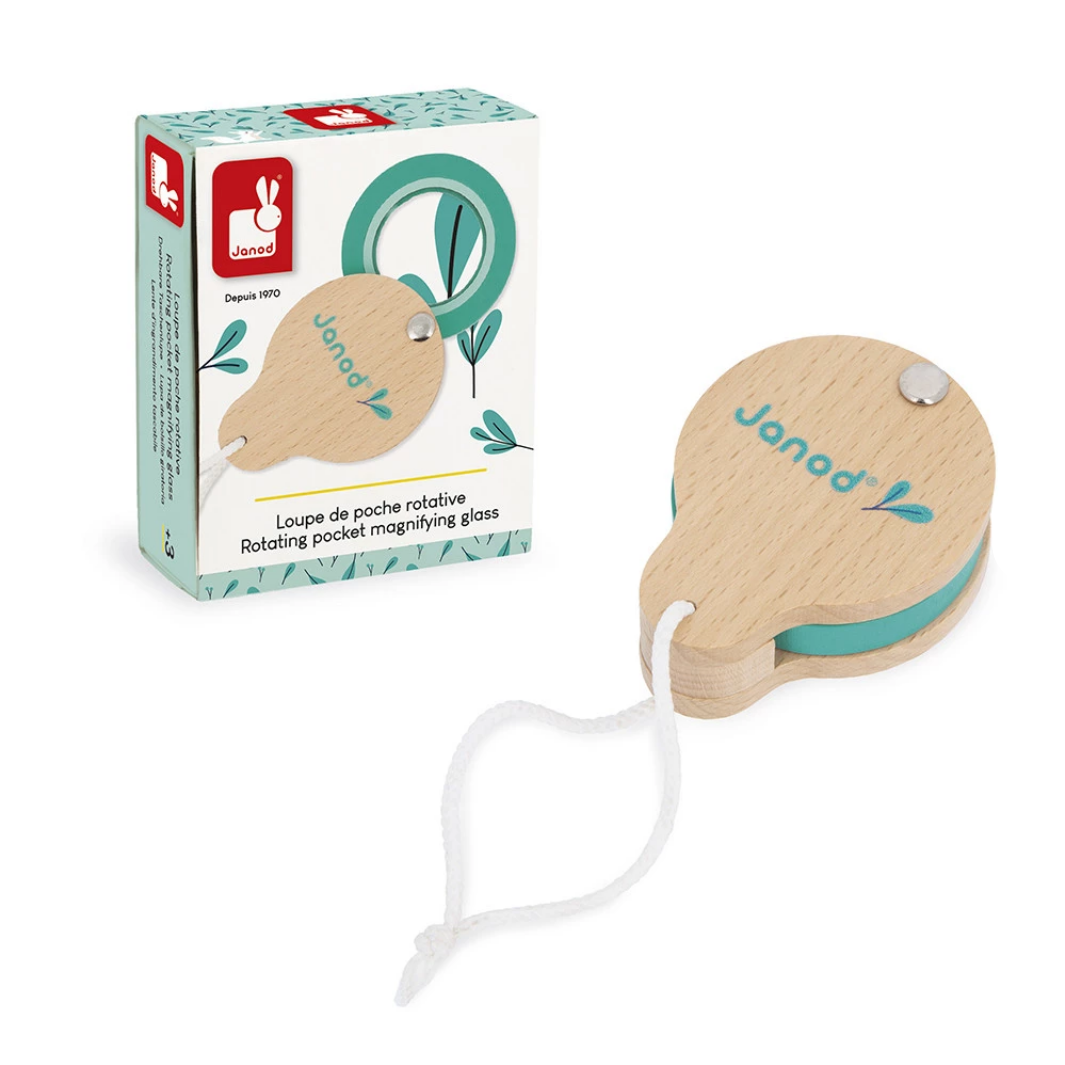 Wooden magnifying glass with string and packaging on a white background