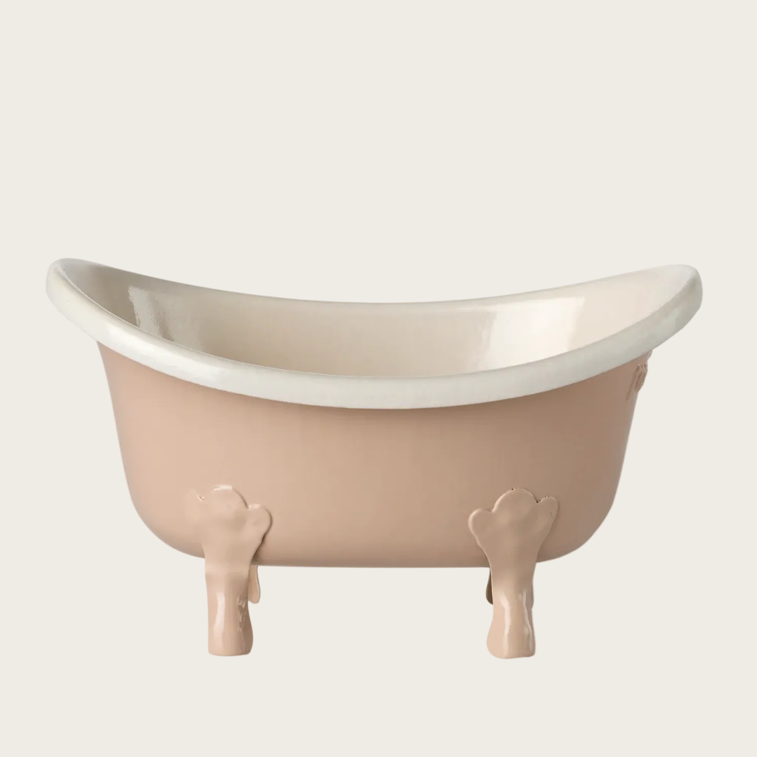 Small bathtub with a white interior and beige exterior on a light gray background