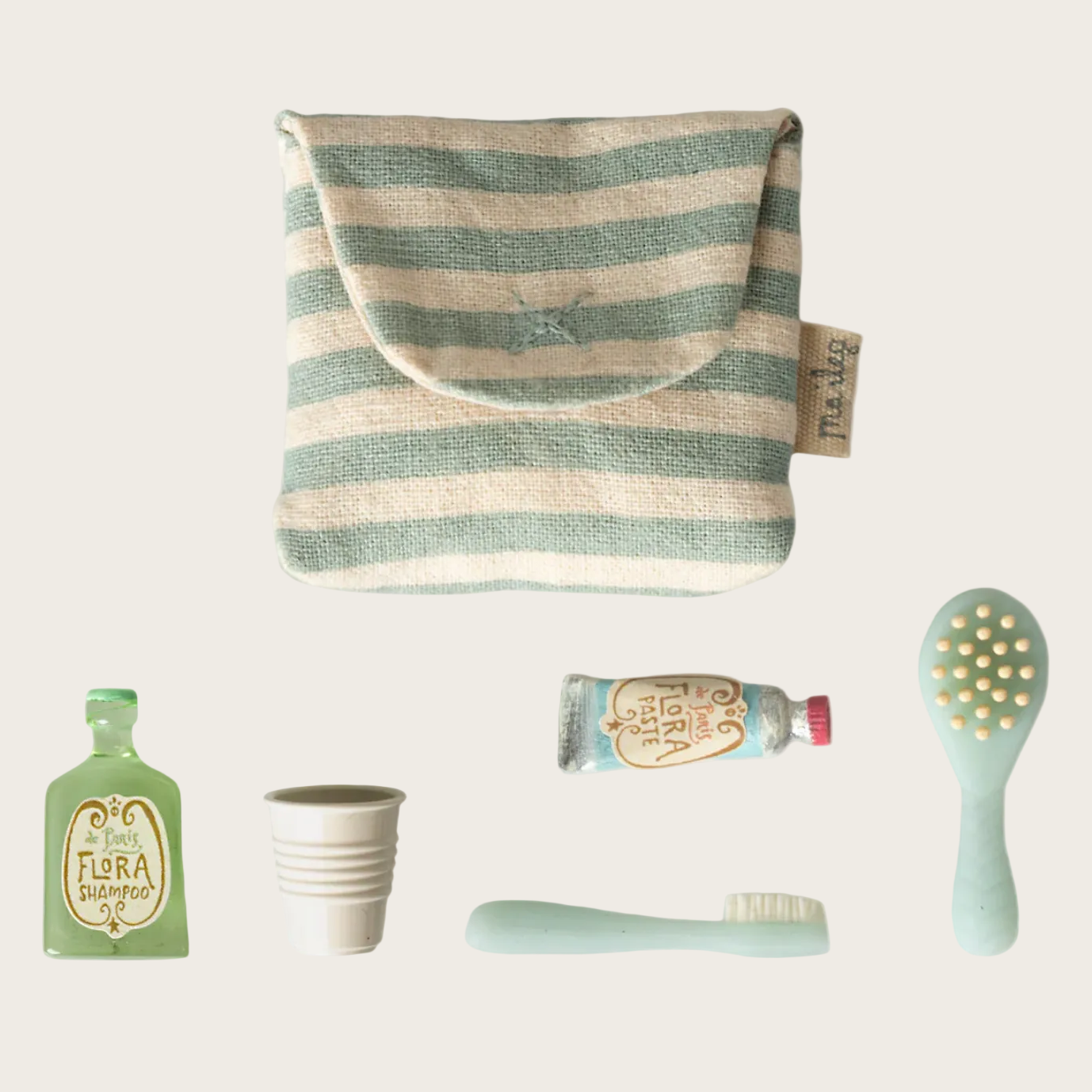 Striped pouch with small items on a white background