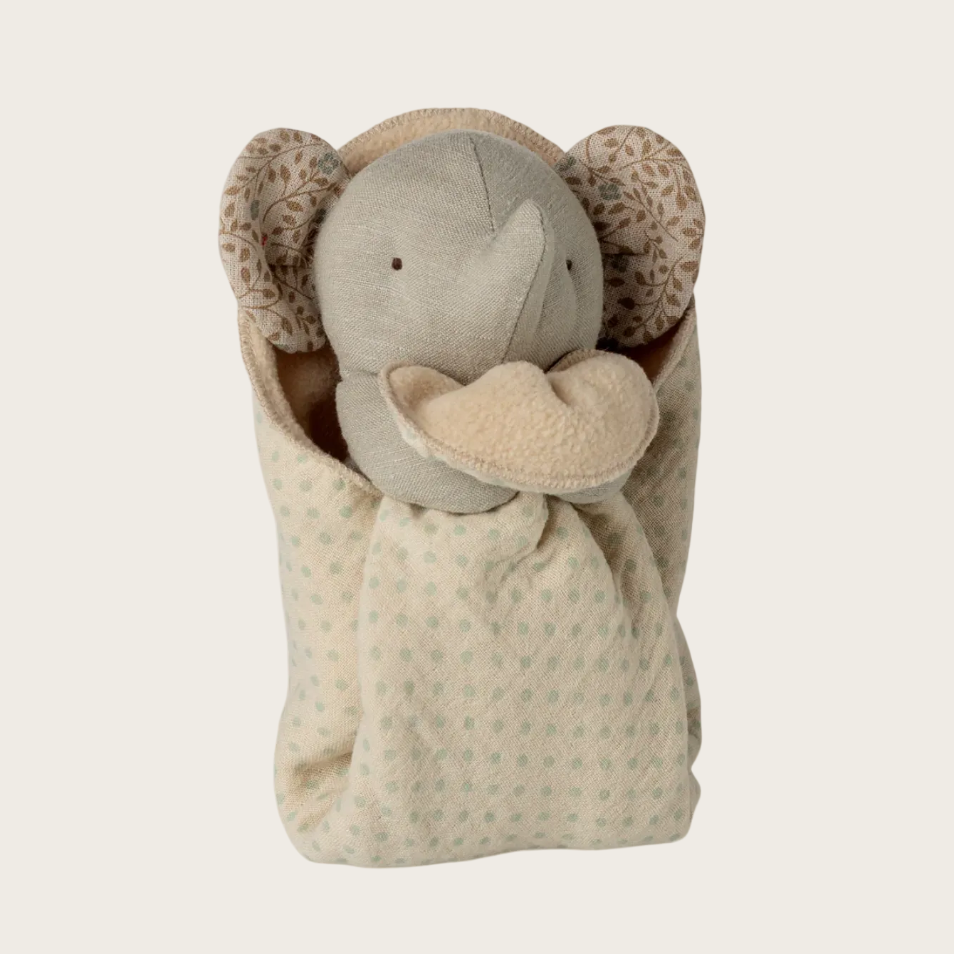 Lullaby friends elephant toy wrapped in a blanket.