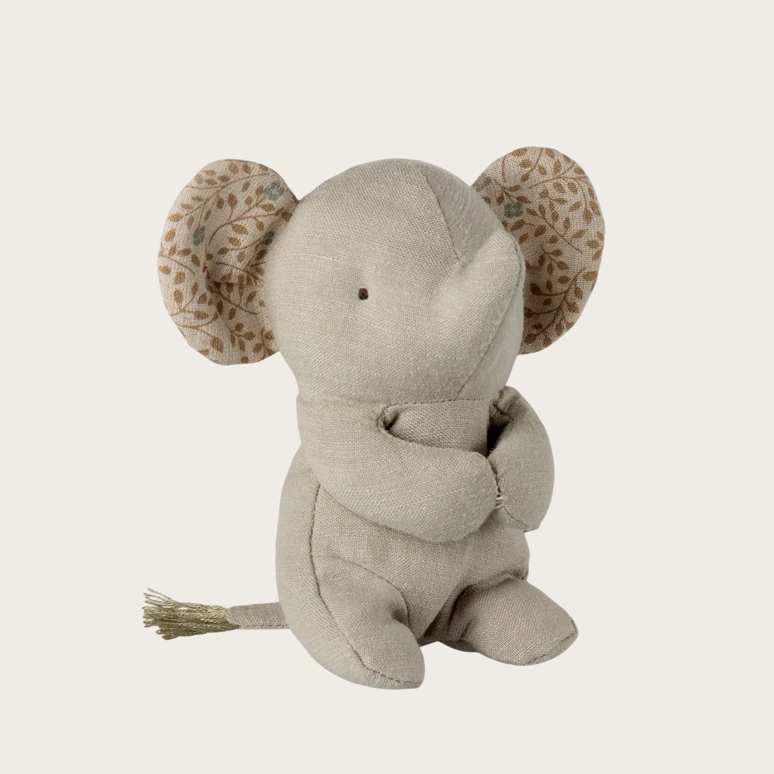 Plush elephant toy with patterned ears on a white background