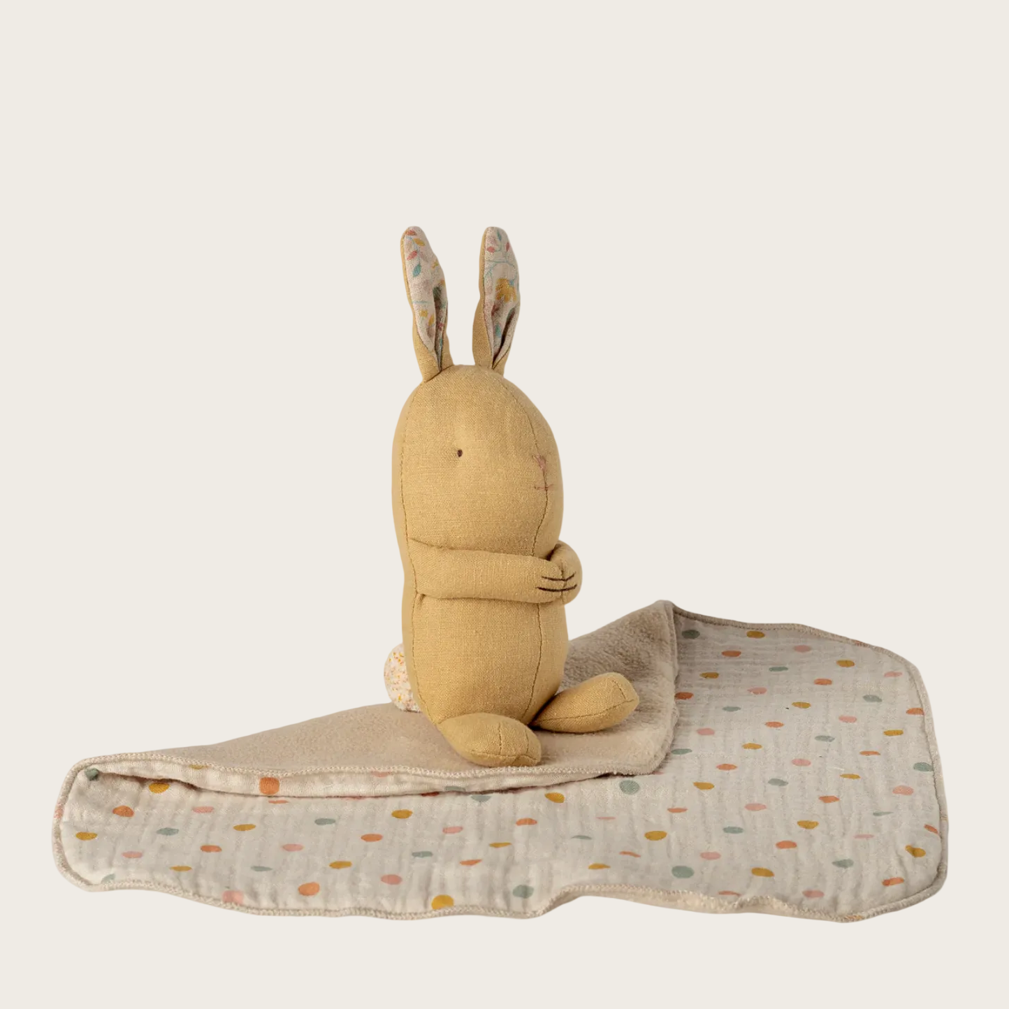 Plush toy rabbit on a blanket 