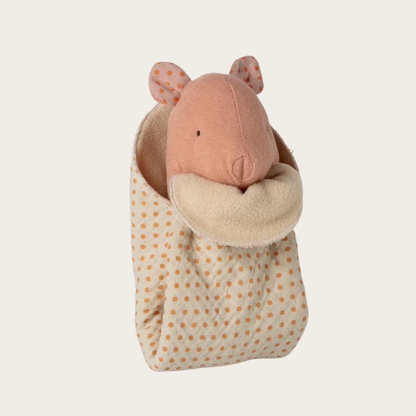 Plush toy pig in a polka dot bag