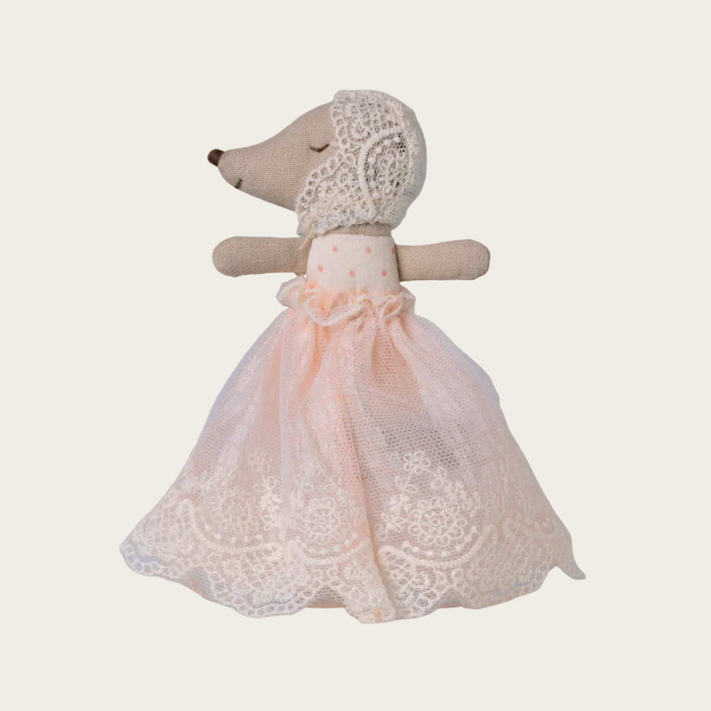 Stuffed toy mouse in a lace dress 