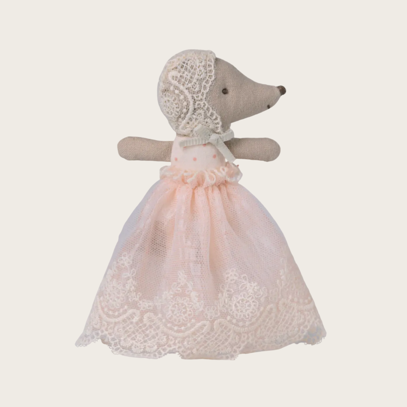 Stuffed toy mouse in a lace dress 