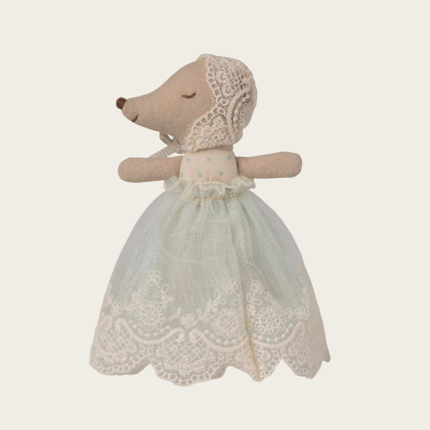 Stuffed animal toy dressed in a lace dress 