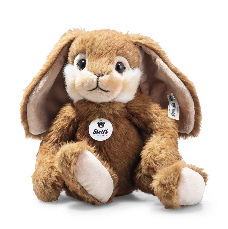 Brown plush bunny toy with a white chest on a white background