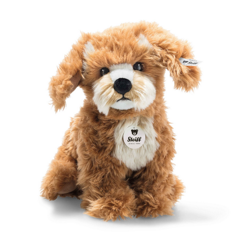 Brown plush dog toy with a white chest on a white background