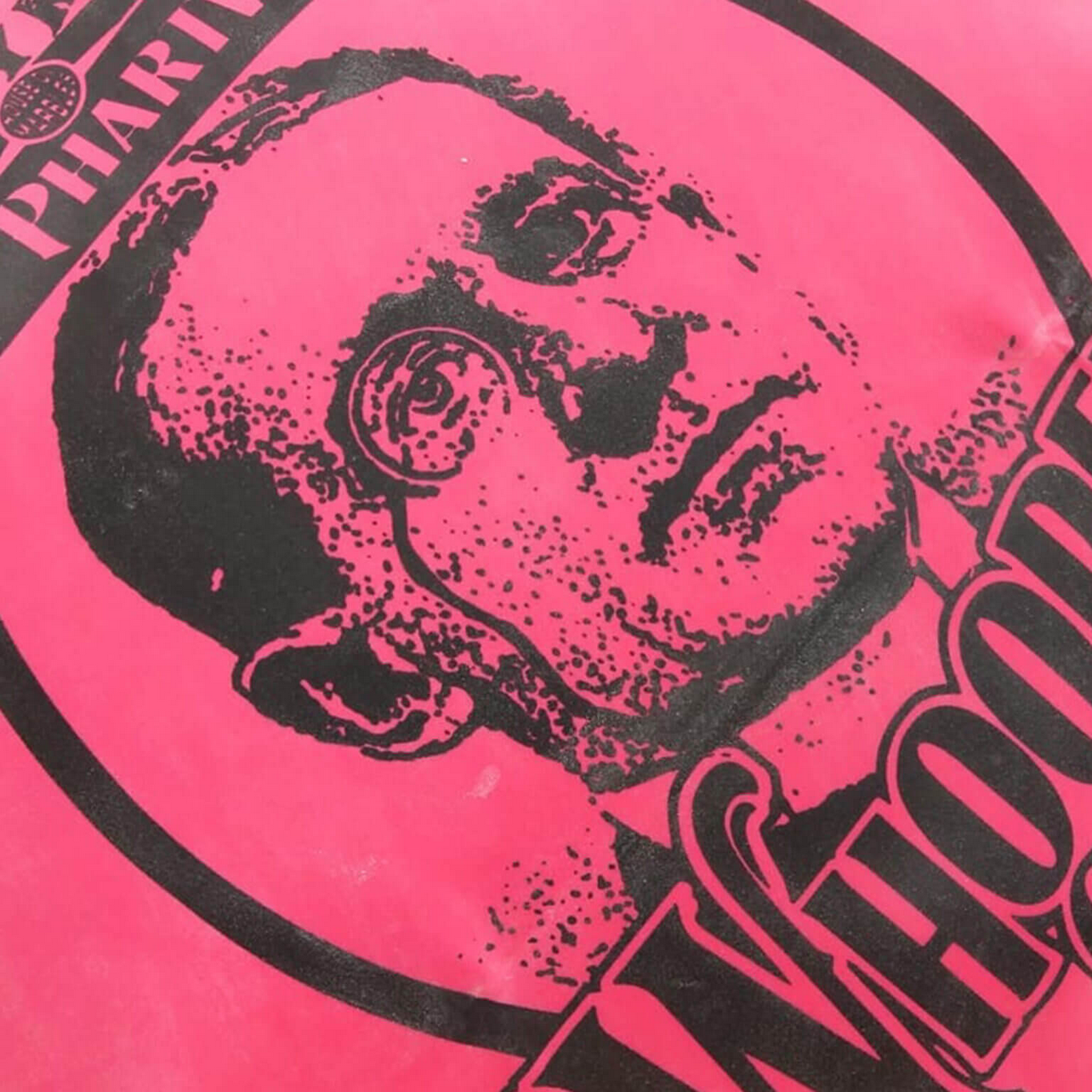 Black and white illustration of a face on a pink background with text