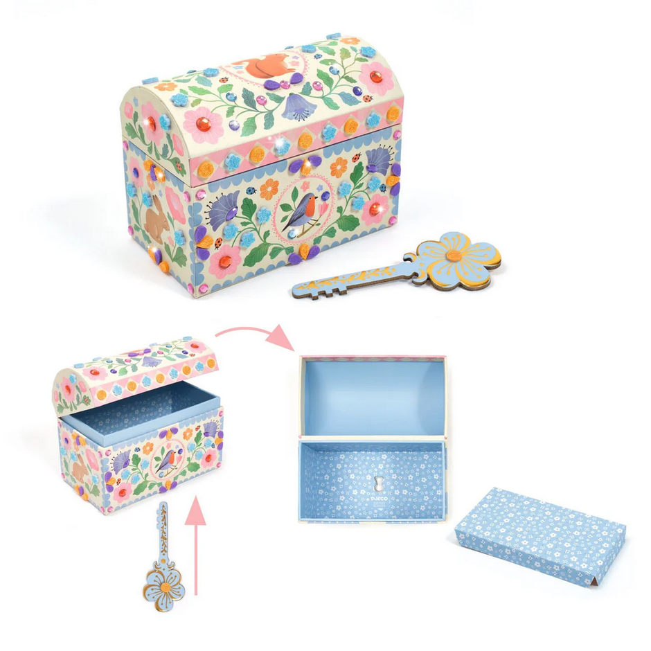 Decorative jewelry box with floral pattern, key, and smaller box on a white background