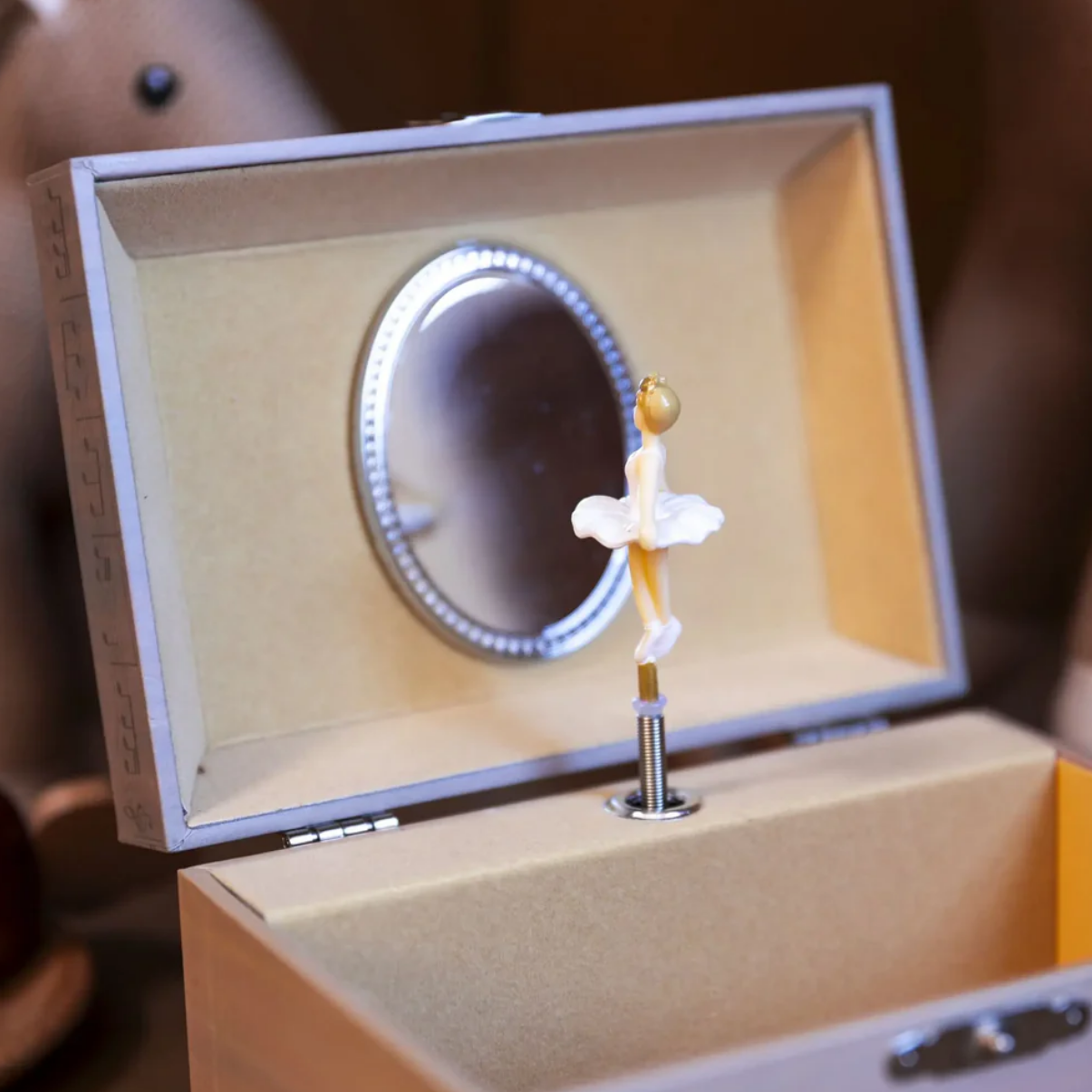 Decorative item in a box with a mirror and candle holder