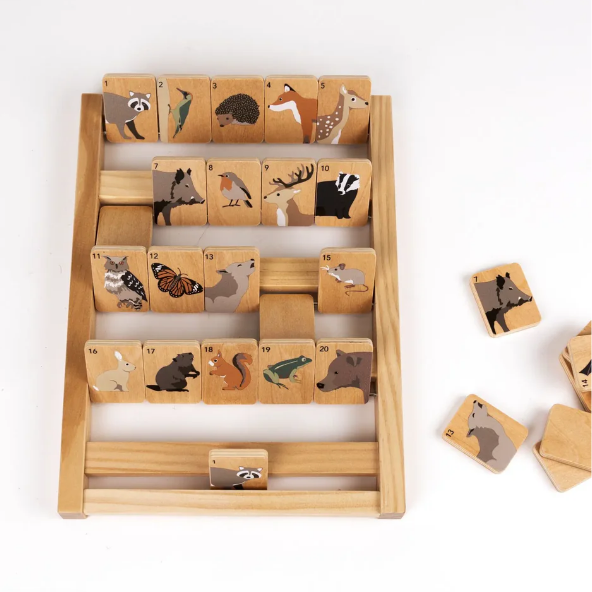 Wooden game with animal illustrations on a white background